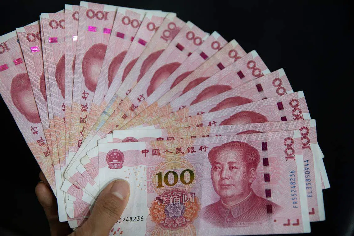 epa07757516 Chinese 100 yuan or renminbi (RMB) notes in Beijing, China, 05 August 2019. China's Yuan fell below the key level of seven to the US Dollar for the first time in eleven years, following the last week's US President Donald Trump's threat for more tariff on Chinese goods, according to media reports on 05 August 2019.  EPA-EFE/ROMAN PILIPEY