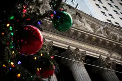 A Christmas tree outside the New York Stock Exchange. The Dow Jones Industrial Average falls 8.47 points or 0.02 per cent at the open to 37,701.63.