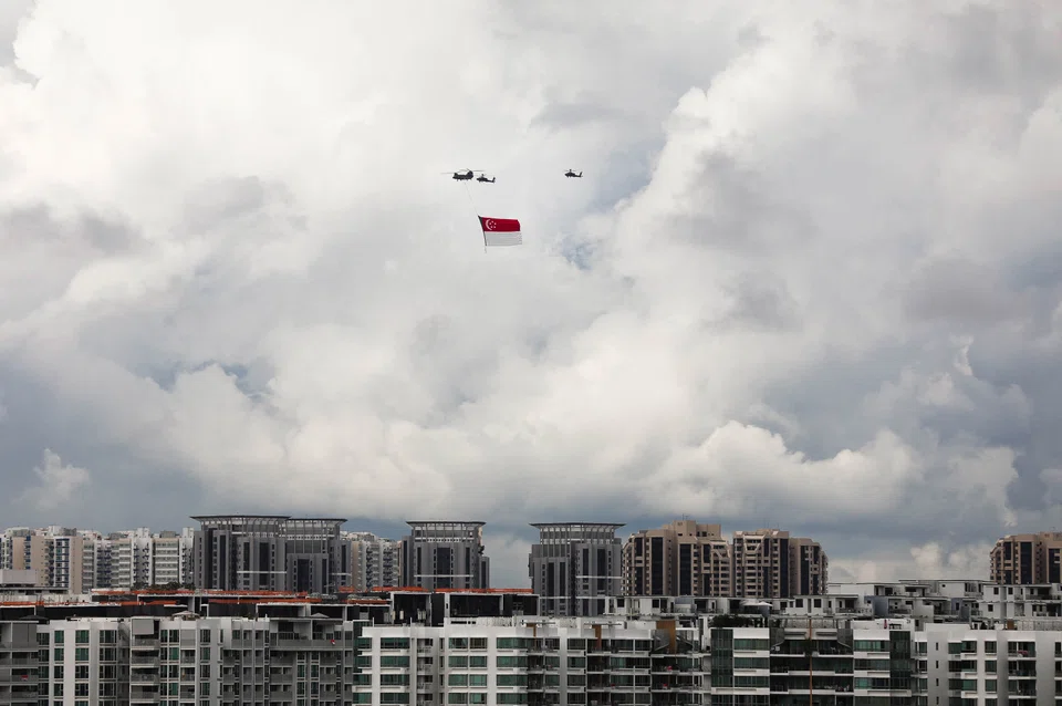 The state flag being flown in a dry run before National Day in 2020. Singapore must be prepared for the international storm that lies ahead, and seek the silver linings to its clouds.