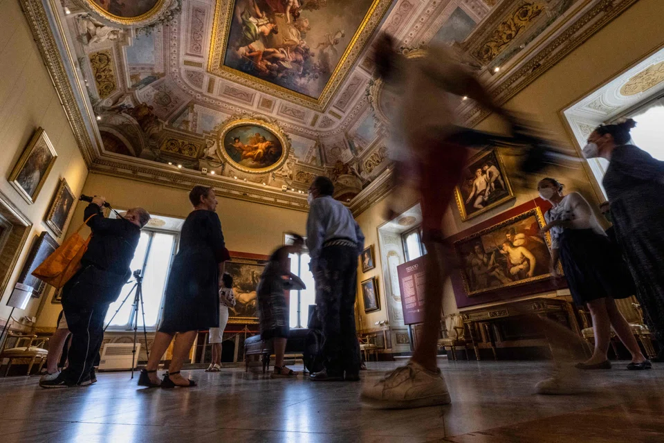 Visitors attending a press preview of the exhibition "Titian: Dialogues of Nature and Love" on June 13, 2022 at the Galleria Borghese in Rome. 