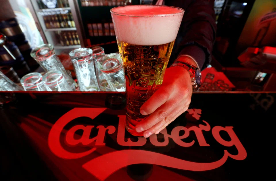 CARLSBERG, the Western brewer most exposed to the Russian market, expects its decision to sell its business there to result in a writedown of about 9.5 billion Danish crowns (US$1.4 billion), it said on Thursday (Apr 21).