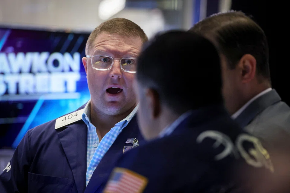 Traders on the floor of the New York Stock Exchange. The Dow Jones' 2.82 per cent drop on Friday was its biggest 1-day fall since October 2020..