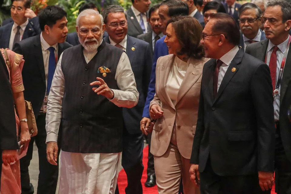 Indian Prime Minister Narendra Modi (left) with US Vice-President Kamala Harris (centre) and Malaysia’s Prime Minister Anwar Ibrahim (right), arriving at the East Asia Summit, which is part of the 43rd Asean Summit in Jakarta.  