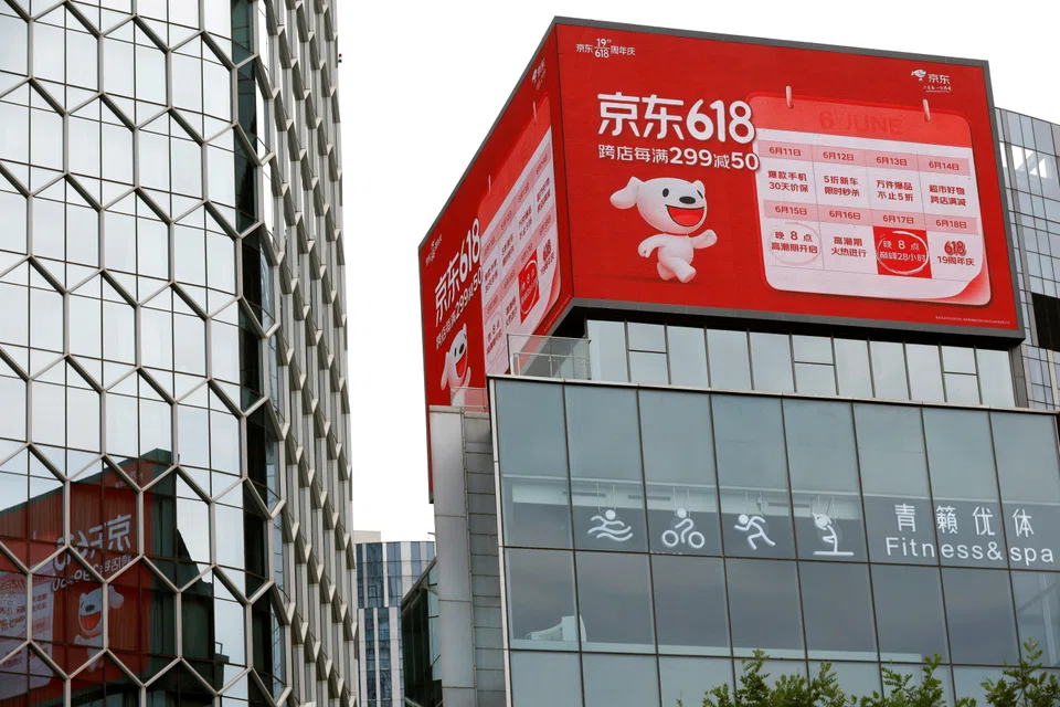 A JD.com advertisement for the "618" shopping festival sits atop a shopping mall in Beijing. The event was the first major shopping festival to take place since several Chinese cities, including Shanghai, were hit by a series of lockdowns to halt the spread of Covid-19.