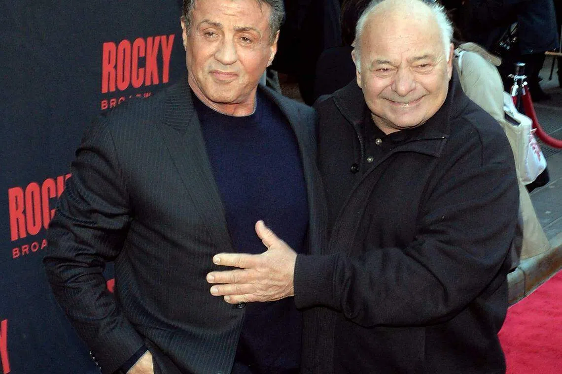 Actors Sylvester Stallone and Burt Young (R) attend the "Rocky" Broadway opening night in 2014 in New York City. Young, a former boxer who earned an Oscar nomination for his breakout role as Sylvester Stallone's sidekick in the Rocky film series, died at 83. 