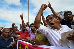 SRI LANKA fell into default for the first time in its history as the government struggles to halt an economic meltdown that prompted mass protests and a political crisis.