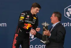 Formula One F1 - Miami Grand Prix - Miami International Autodrome, Miami, Florida, U.S. - May 8, 2022 Red Bull's Max Verstappen celebrates on the podium after winning the Miami Grand Prix with the trophy and Dan Marino. 