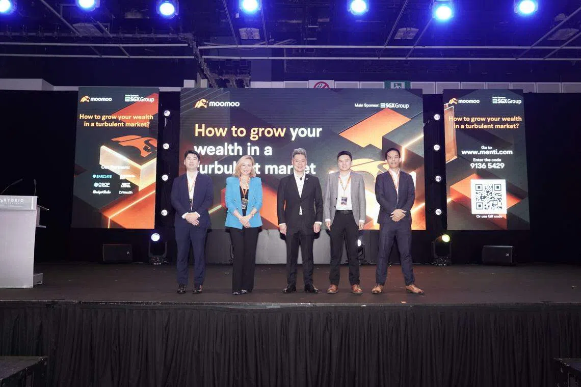 Staying invested is the best way to reach one's investment objectives, said Evonne Tan (second from left), head of private banking at Barclays Singapore, at moomoo's seminar on Jul 16.