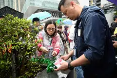 Protesters have been required to wear number tags.