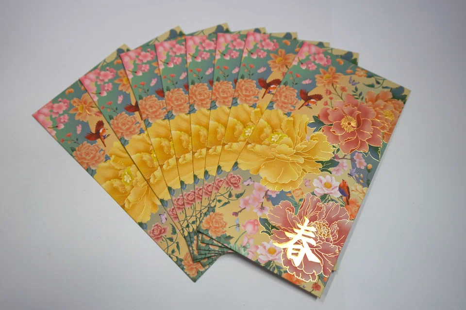 Printers have noticed more orders for hongbao in non-traditional colours such as gold, pink or cream.