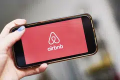 Airbnb says more travellers are coming back to cities, its traditional stronghold, with bookings for high-density urban listings up 13 per cent. 