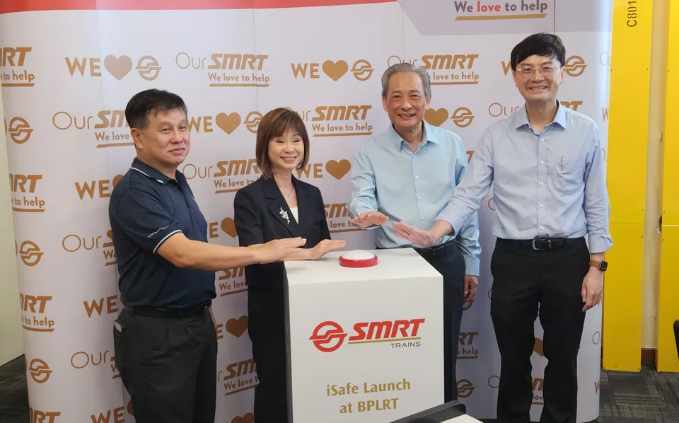 (From left) Yeo Teck Guan, senior group director for public transport for the Land Transport Authority; Dr Amy Khor, Senior Minister of State, Ministry of Sustainability and the Environment, and Ministry of Transport; Seah Moon Ming, chairman of SMRT Corporation; Ngien Hoon Ping group chief executive officer of SMRT Corporation; at the launch ceremony for SMRT's iSafe system at Bukit Panjang Light Rail Transit Depot. 
