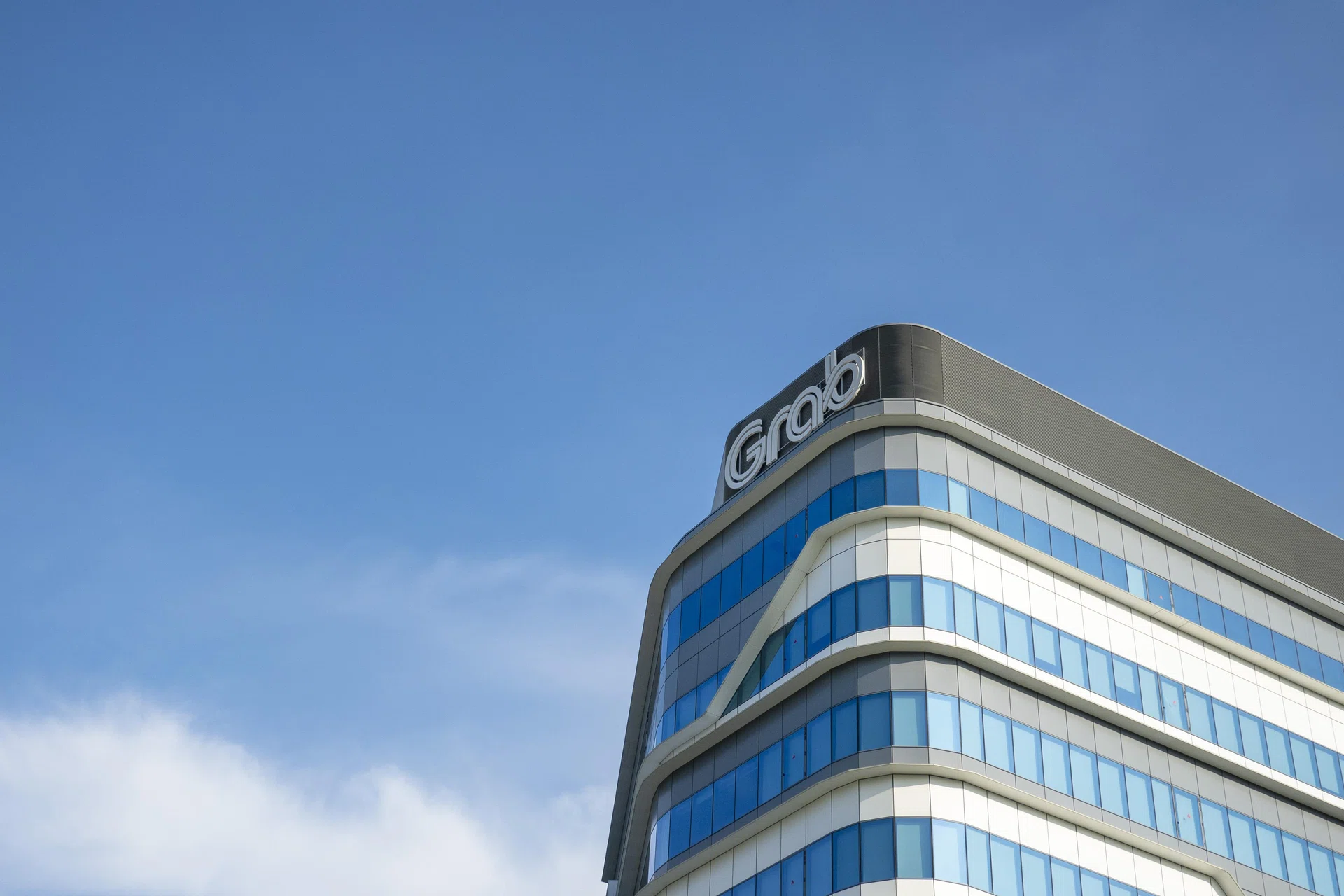 Brokers' take: DBS cuts Grab target price, expects slowdown in mobility ...