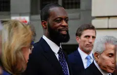 Grammy Award-winning rapper Prakazrel "Pras" Michel of the hip hop group "The Fugees" leaves US federal court with his attorneys after being convicted on criminal charges that he conspired with Jho Low to orchestrate a series of foreign lobbying campaigns aimed at influencing the US government, in Washington, April 26, 2023.   