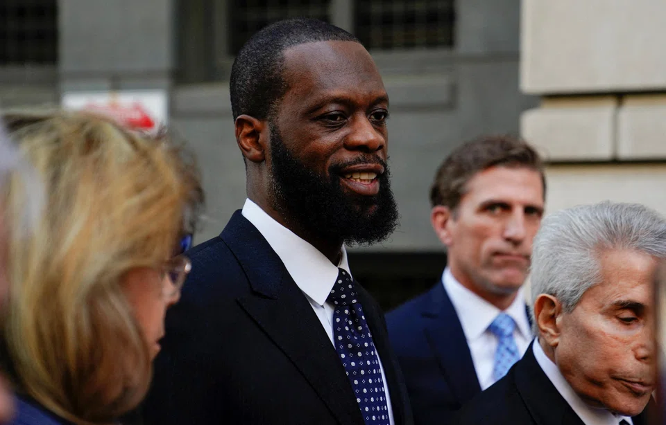 Grammy Award-winning rapper Prakazrel "Pras" Michel of the hip hop group "The Fugees" leaves US federal court with his attorneys after being convicted on criminal charges that he conspired with Jho Low to orchestrate a series of foreign lobbying campaigns aimed at influencing the US government, in Washington, April 26, 2023.   
