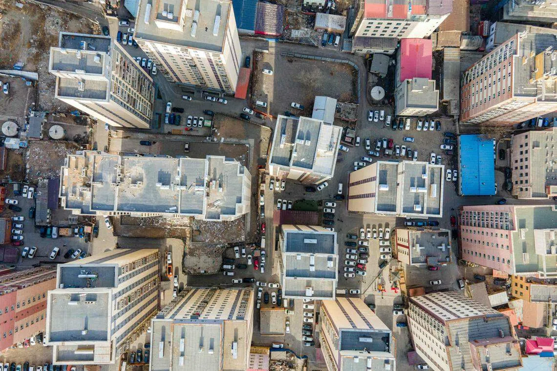 An aerial view of residential buildings in Mongolia's capital Ulaanbaatar. Locals say the construction boom – fuelled by a decade-long mining windfall – is squeezing out room for much-needed public services, from new hospitals to children’s playgrounds.