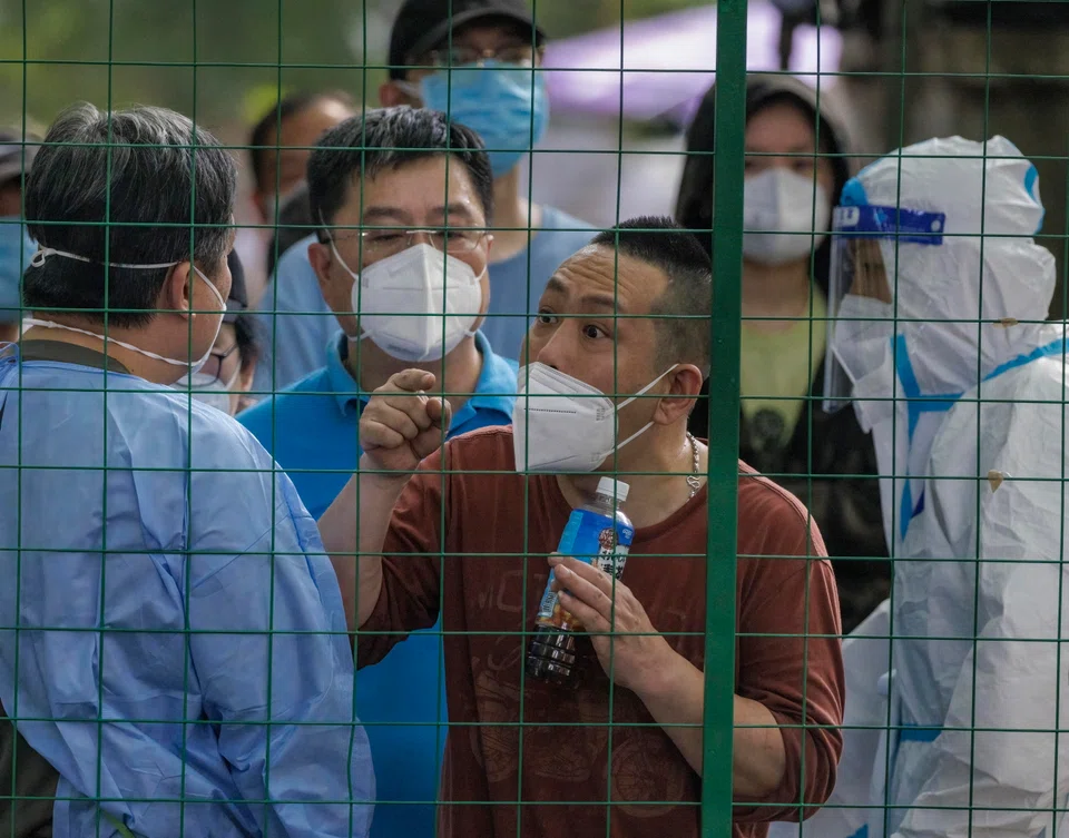 People protesting behind a quarantine fence amid a new round of Covid-19 lockdowns in Shanghai, China, earlier this month. XD Inc's founder and chief executive did not mention Beijing's zero-Covid policy as a reason for him to relocate, but has said he hopes the policy will be relaxed.  