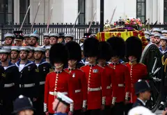 The coffin of Britain's Queen Elizabeth being borne on a gun carriage through London, from Westminster Hall, where it has lain in state for the last 4 days, to Westminster Abbey for the funeral service. 
