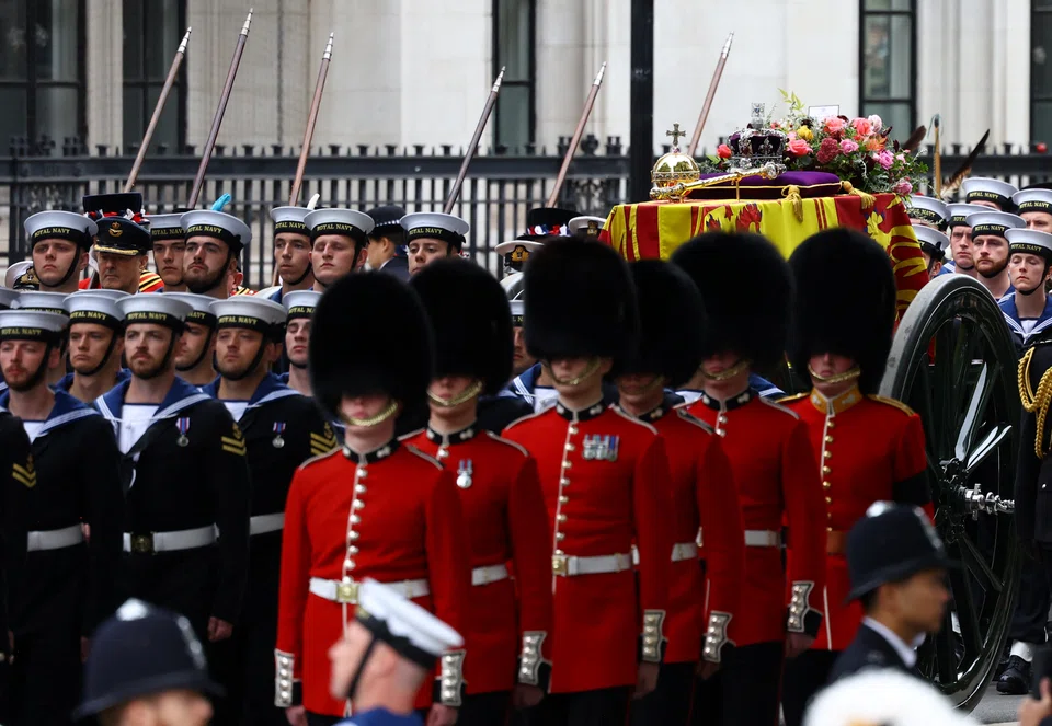 The coffin of Britain's Queen Elizabeth being borne on a gun carriage through London, from Westminster Hall, where it has lain in state for the last 4 days, to Westminster Abbey for the funeral service. 