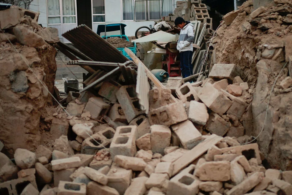 A boy stands amid the rubble of his house after it collapsed in the earthquake in China's Gansu province in December 2023. Such destruction caused by natural disasters drives home to industry professionals the difference that insurance can make.