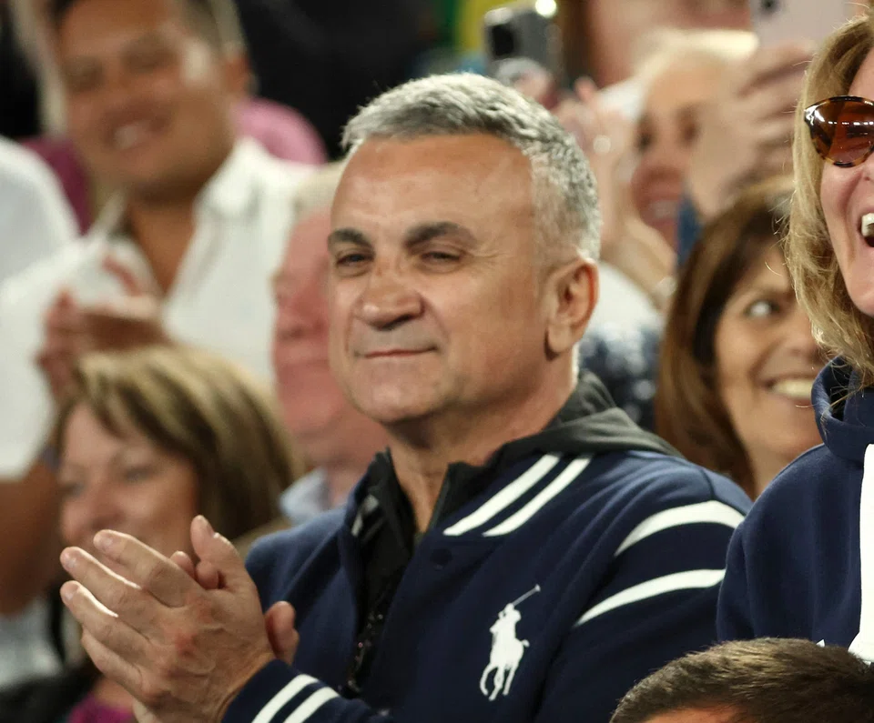 Srdjan Djokovic denies having intentionally joined a group of pro-Russia fans following his son's victory at the Australian Open quarter-final.