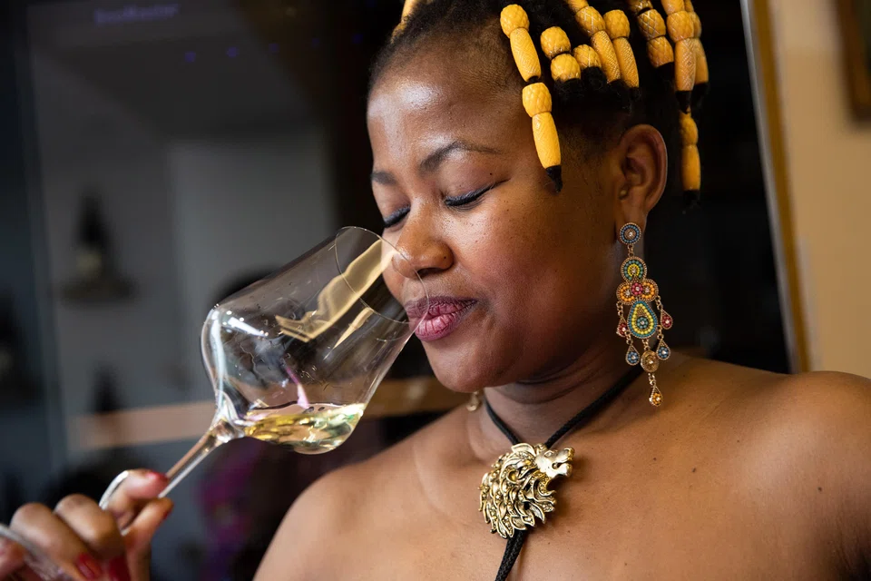 Fiona Masuku sniffs a wine at Great Heart Wines in Franschhoek, South Africa. White South Africans control a vast majority of the country’s wine industry, but it’s growing increasingly possible to support Black winemakers and owners.