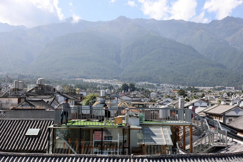 The area has long been a hub for backpackers and artists, who were lured by its cheap rents and idyllic old town, where ancient city gates and white-walled courtyard homes point to the history of the Bai ethnic minority, who have lived there for thousands of years.