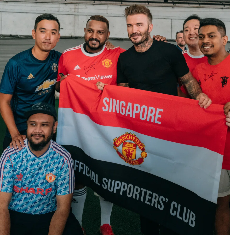 Former England captain and Manchester United midfielder David Beckham with some lucky fans at The Cage in Kallang on June 18, 2022.