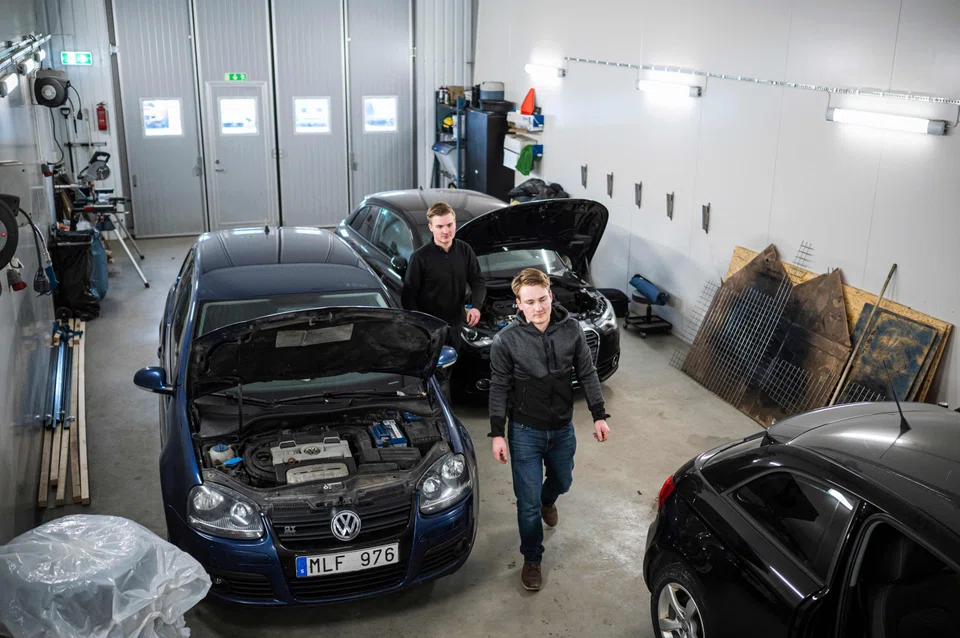 Oskar Flyman (right) and his brother Jakob working in their garage in Balsta, north-west of Stockholm. They specialise in converting regular cars into A-traktors. 