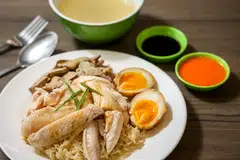Chicken rice is found at almost every dining spot in Singapore, from hawker centres to high-end restaurants, and consists of poached chicken, rice and a garlic chili dip.