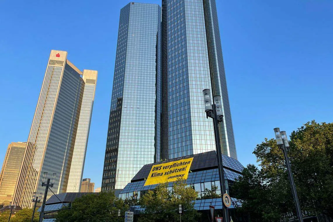 Greenpeace activists on Wednesday (Jun 14) strung up a large yellow banner on Deutsche Bank’s headquarters in Frankfurt. The German-language banner translates as “Force DWS, protect the climate”.
