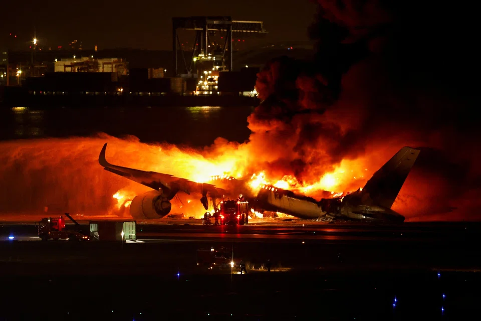 All 379 passengers and crew of a Japan Airlines plane miraculously escaped from a fire that broke out after the collision, but local media said five of the Coast Guard plane six member crew had died.