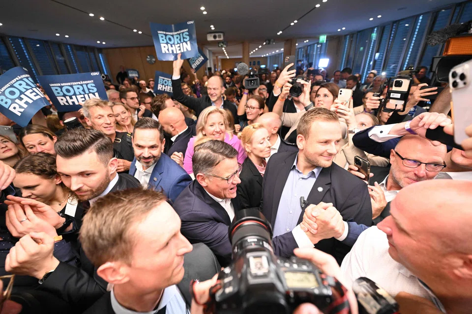 Hessen's State Premier and top candidate of the conservative Christian Democratic Union (CDU) party Boris Rhein greets his supporters at the State Parliament of Hessen in Wiesbaden, western Germany, as first exit polls were released of regional elections in the western federal state of Hessen on Oct 8, 2023. 