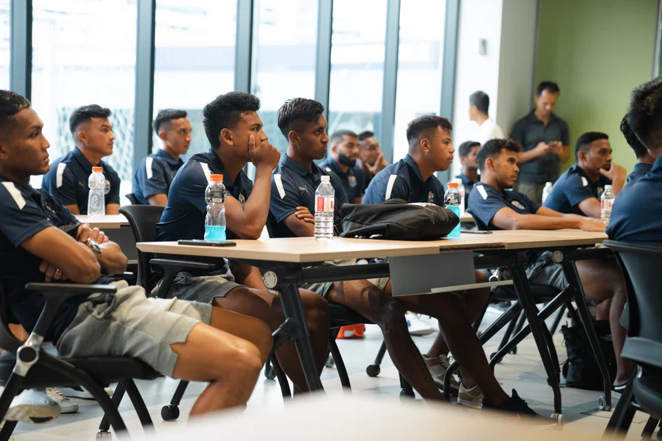 Lion City Sailors players attending the first of a series of financial literacy workshops conducted by SGX.