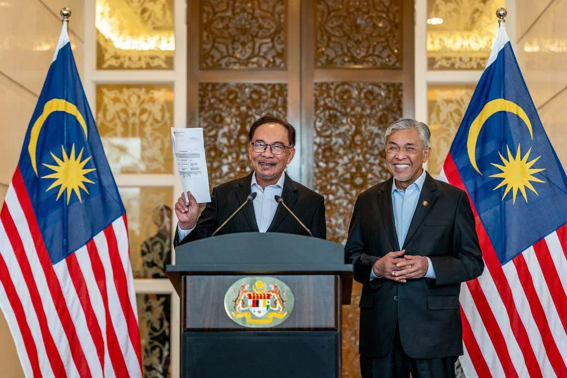 Malaysia Prime Minister Anwar Ibrahim (left), with Deputy Prime Minister Ahmad Zahid Hamidi. Anwar has announced a new Cabinet line-up of 60 people, up from 55 previously.