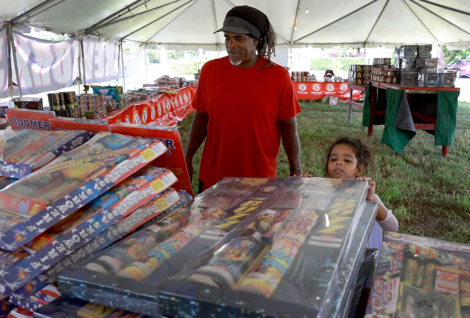 Customers shop for fireworks at Champion Fireworks on July 1, 2022 in Doral, Florida. Firework displays have been cancelled in cities across the United States.