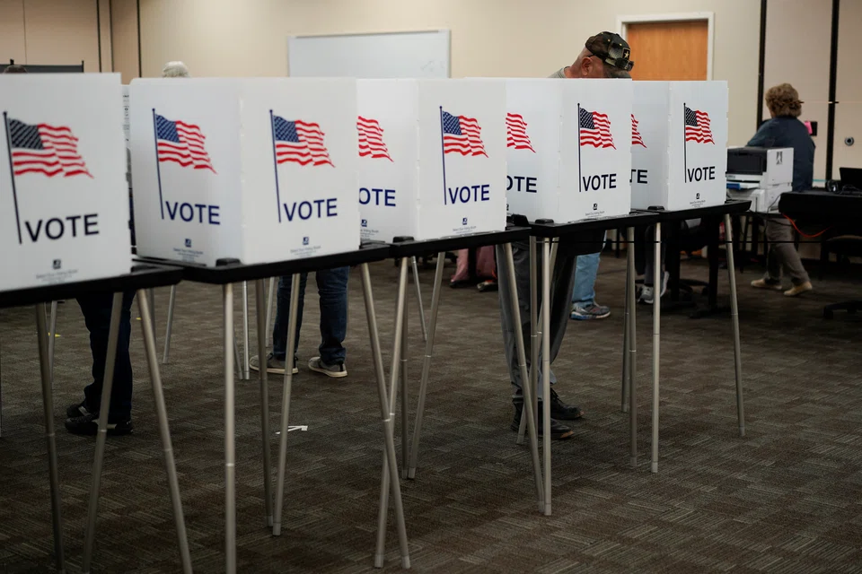 People cast their ballots early for the upcoming midterm elections in Las Cruces, New Mexico, US, Oct 24, 2022.  