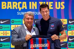 Barcelona's new striker Robert Lewandowski (right) with club president Joan Laporta at a press conference in the United States. Barcelona plays arch-rivals Real Madrid in Las Vegas on Saturday night.