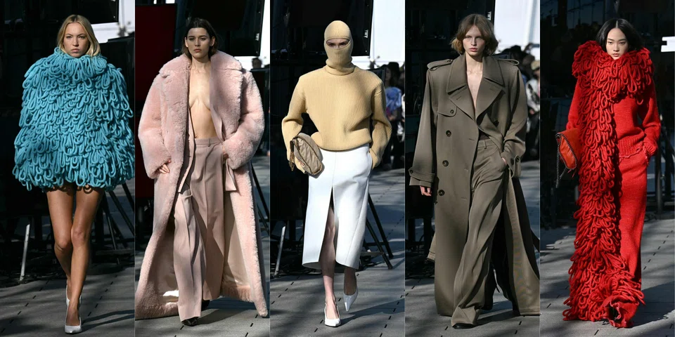 Models strode onto the runway parading loosely-tailored suits with prominent shoulders and low cut trousers, silky dresses cut asymmetrically, leather-like trench coats made from apple-based material and hulking, cape-like coats made with patchworks of wool.