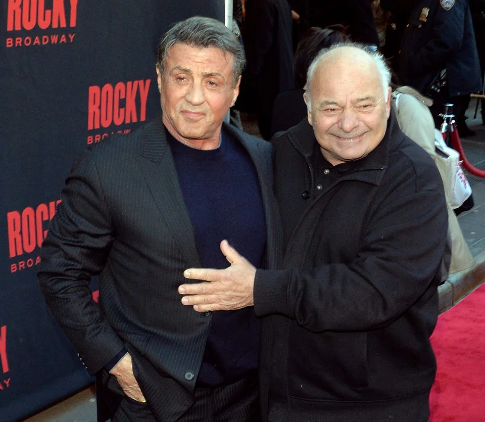 Actors Sylvester Stallone and Burt Young (R) attend the "Rocky" Broadway opening night in 2014 in New York City. Young, a former boxer who earned an Oscar nomination for his breakout role as Sylvester Stallone's sidekick in the Rocky film series, died at 83. 