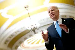 Asked during a brief exchange with reporters when he would announce he is running again, Joe Biden teased with a smile: “When I announce it.”