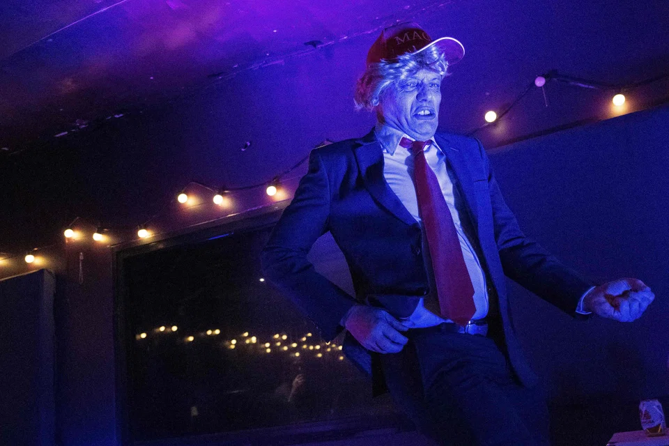 Rob "Donald Trump" Palmer performing during the 2022 Thailand Air Guitar Championships in Bangkok on June 18, 2022. 