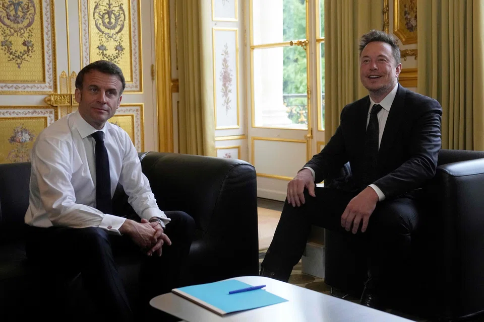 Tesla CEO Elon Musk meets with France's President Emmanuel Macron (left) at the Elysee presidential palace in Paris, May 15, 2023. Musk will meet Macron on Friday for the second time in just over a month. 