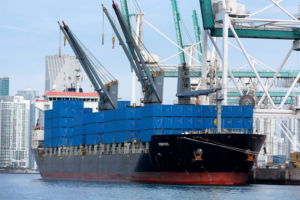 A cargo ship sits at a port in Florida. Asia's export growth is likely to slump from its mid-teens to the low single-digits by the end of this year, and fall into negative territory in early-2023, as demand from China, the US and Europe slows down.