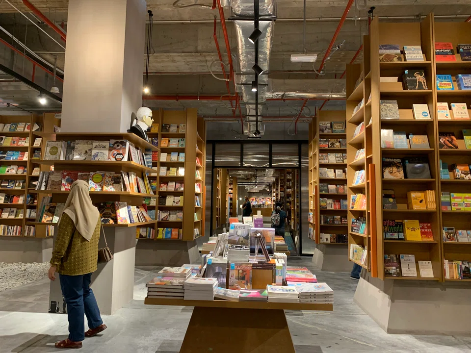 The 31,200 square feet BookXcess outlet in MyTown Shopping Centre is filled with over 170,000 books, displayed on towering shelves on stoned walkways. 