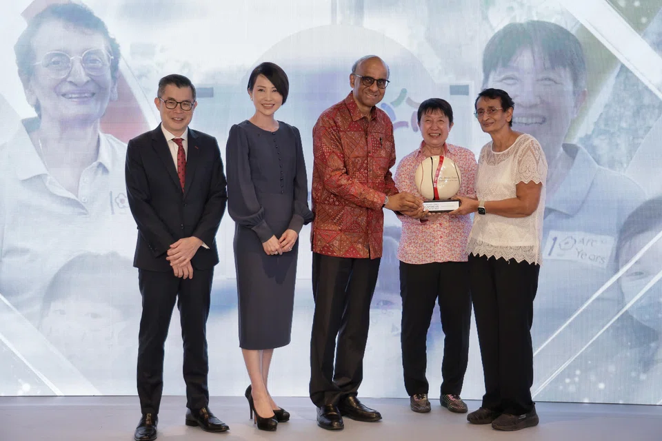 (From right) ST Singaporean of the Year 2023 joint winners Ronita Paul and Geraldine Lee receiving their award from President Tharman Shanmugaratnam. With them are Ms Young Jin Yee, co-head of UBS wealth management in the Asia-Pacific and country head of UBS Singapore, and ST editor Jaime Ho. 