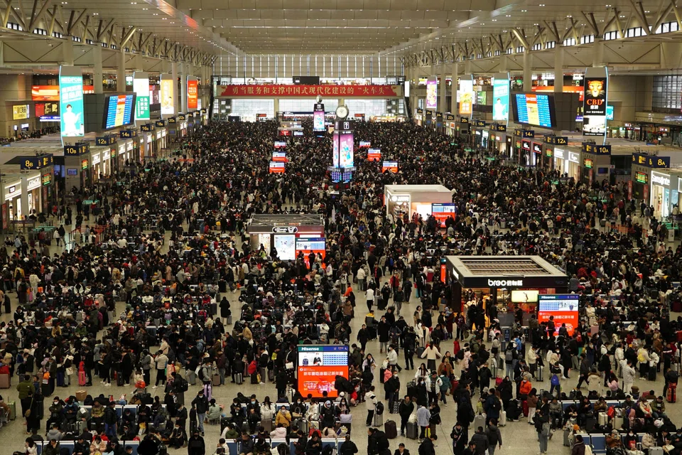 Travellers wait for their trains at Shanghai Hongqiao railway station, during the Spring Festival travel rush ahead of the Chinese New Year.
