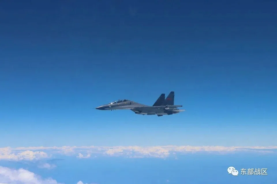 An Air Force aircraft of China's People's Liberation Army (PLA) takes part in military exercises in the waters around Taiwan on Aug 4. 