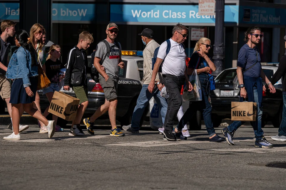 US GDP rises at an upwardly revised 5.2 per cent annualised pace in the third quarter, the fastest in nearly two years.