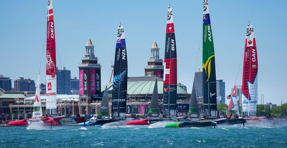 The fleet sailing past spectators at Navy Pier on Race Day 1 of the Sail Grand Prix in Chicago in June 2022. 